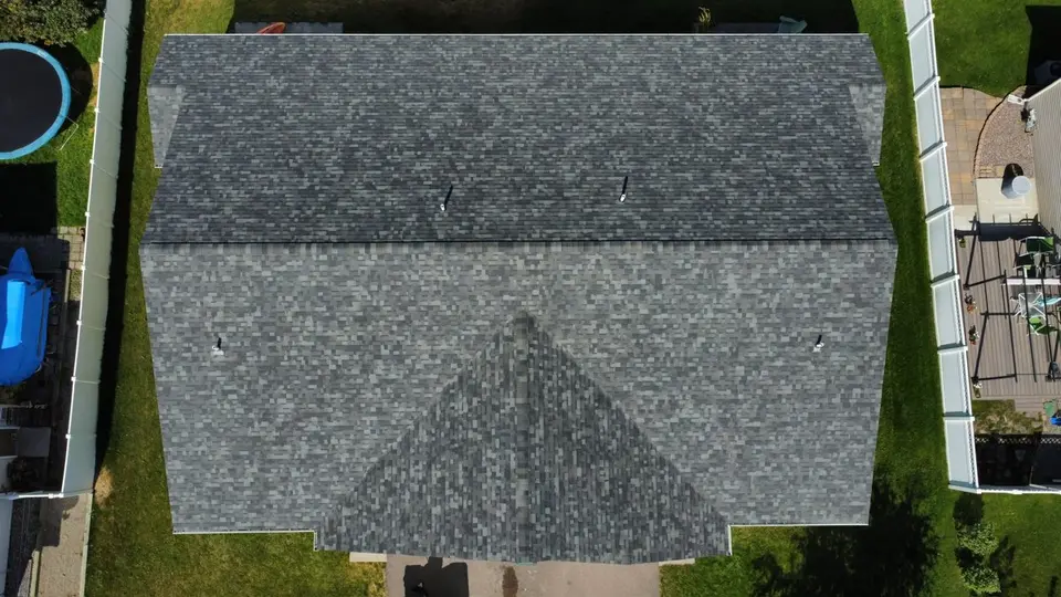 Aerial drone photo of a gray low-slope roof on a Flathead Valley building