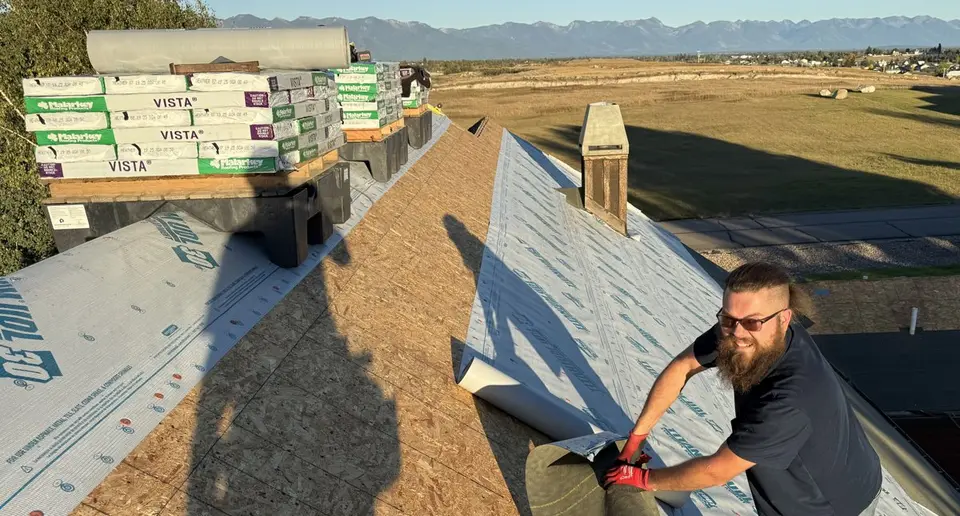 Sisu Roofing crew working on a roof in the Flathead Valley