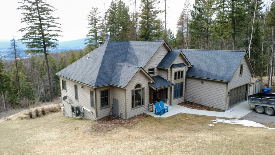 Sisu crew replacing an asphalt shingle roof on a Flathead Valley home