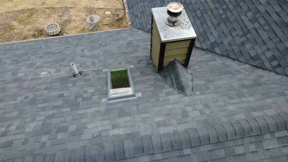 Two skylights flashed into an asphalt shingle roof, seen from above